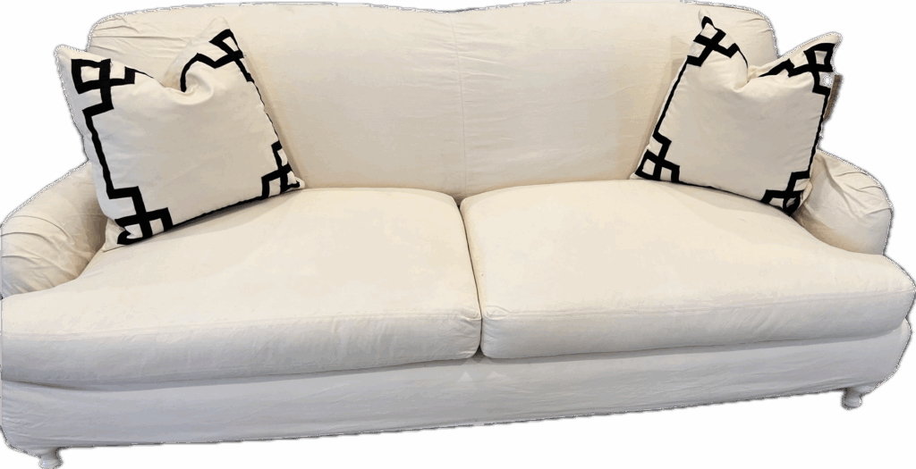 Cream Slipcovered Sofa with Matching Pillows