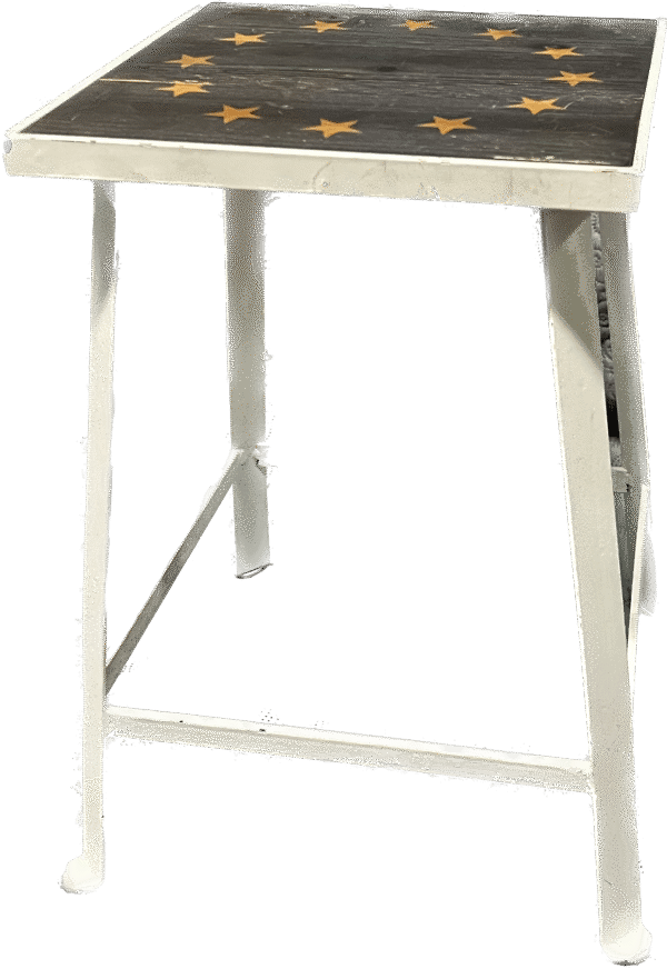 White Metal Table with Yellow Star Graphic on Top